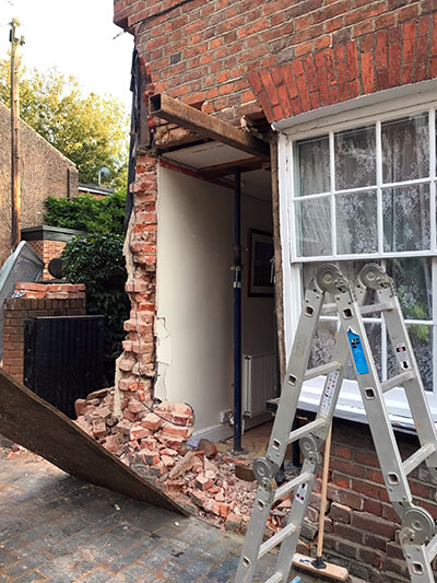 Loose brickwork removed from the damaged house
